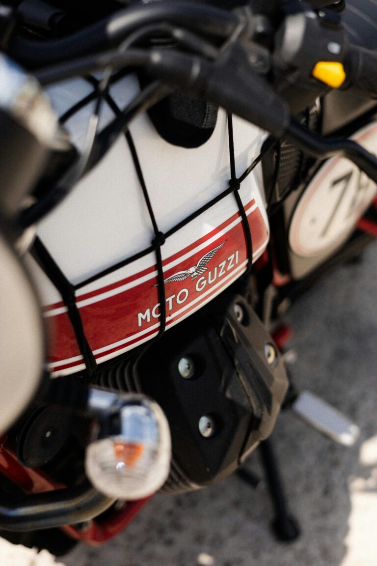 Close-up of a classic Moto Guzzi motorcycle parked in Napoli, Italy.