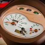 Detailed view of a motorcycle speedometer and instrument cluster.