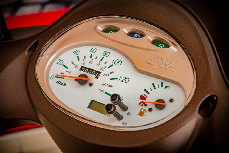 Detailed view of a motorcycle speedometer and instrument cluster.