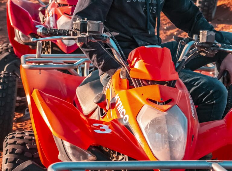 Experience the thrill of quad biking with helmets in Morocco's vast desert landscape.